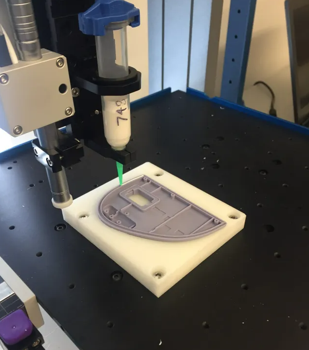 Controlled adhesive dispensing path